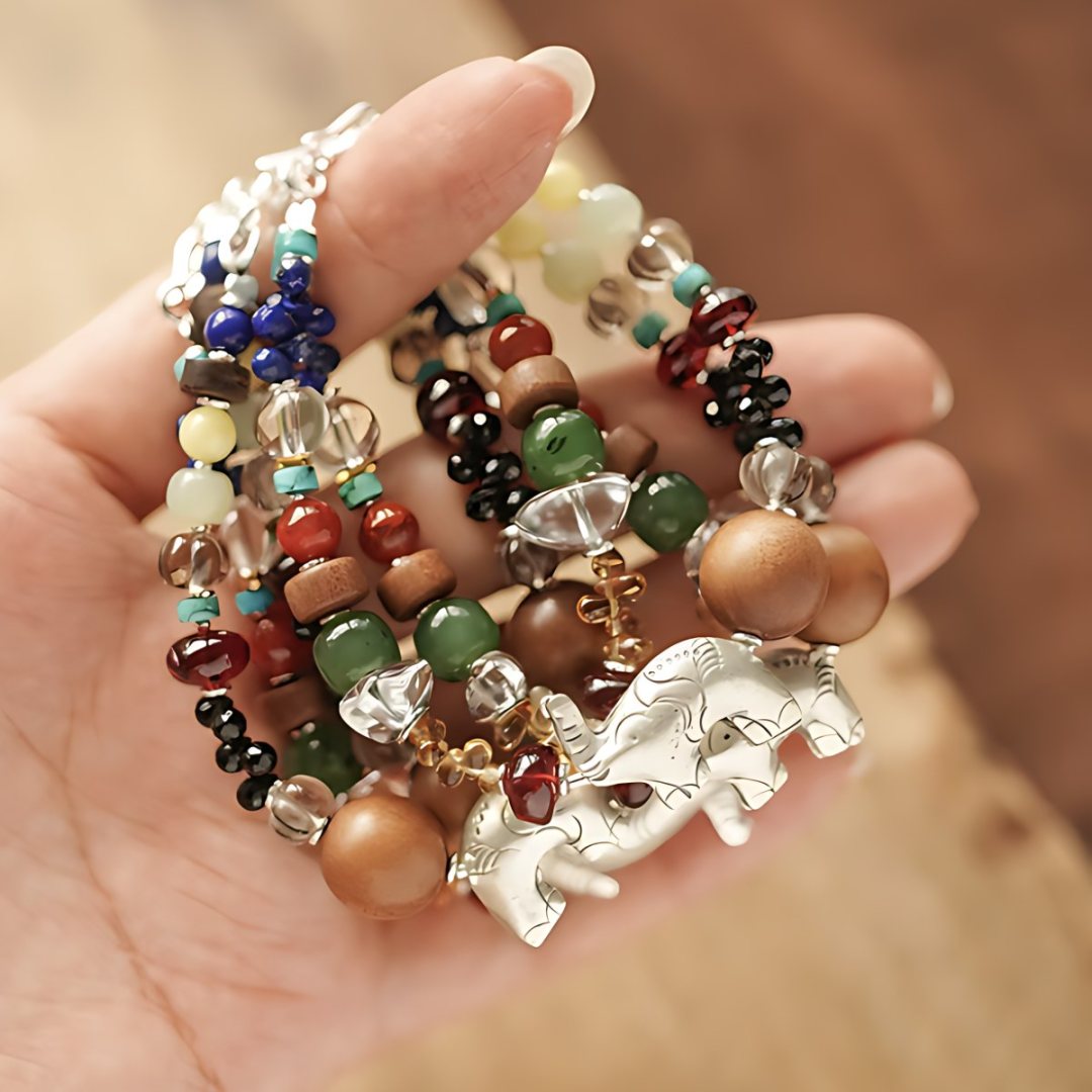 Elephant of Small Miracles, handmade lapis lazuli, clear quartz and carnelian bracelet worn on the hand