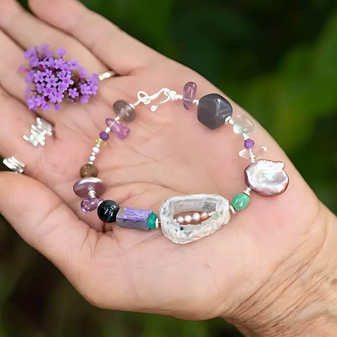 Pocket Galaxy, handmade amethyst, clear quartz and pearl bracelet worn on the hand
