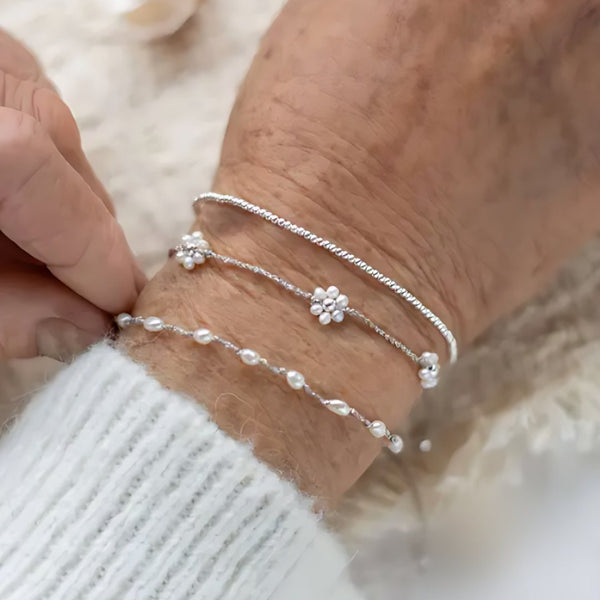 Daisy Dew, handmade pearl and S925 silver bracelet worn on the hand