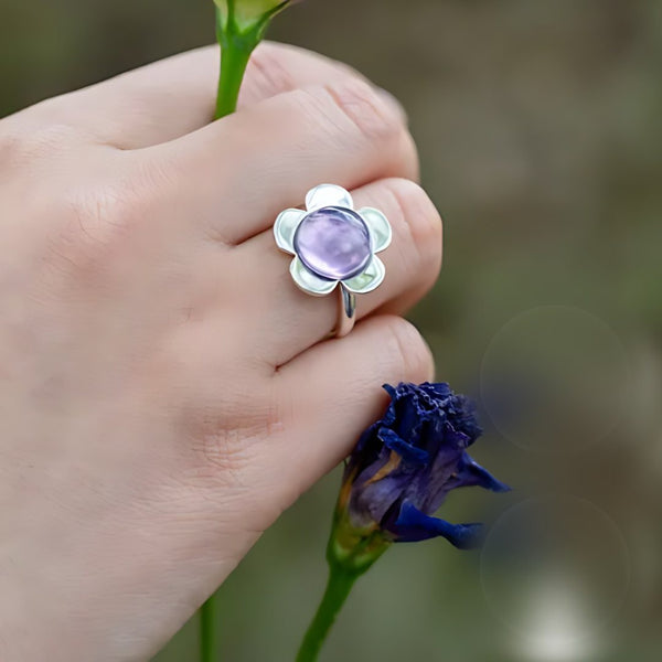 Dusk Bloom, handmade amethyst ring worn on the hand