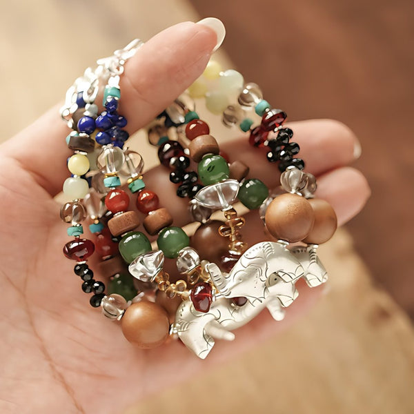 Elephant of Small Miracles, handmade lapis lazuli, clear quartz and carnelian bracelet worn on the hand