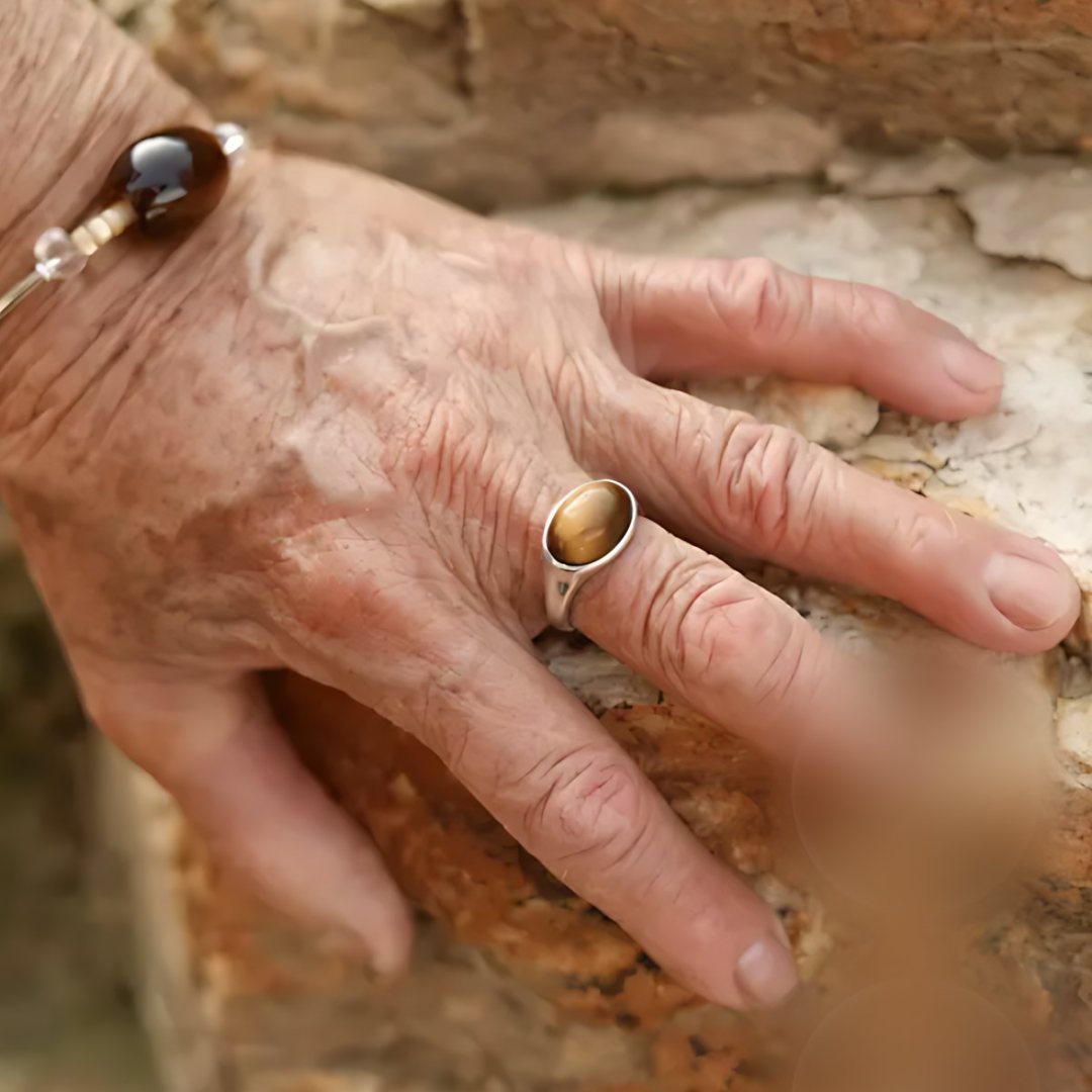 Golden Hour Eye, handmade tiger's eye ring worn on the hand