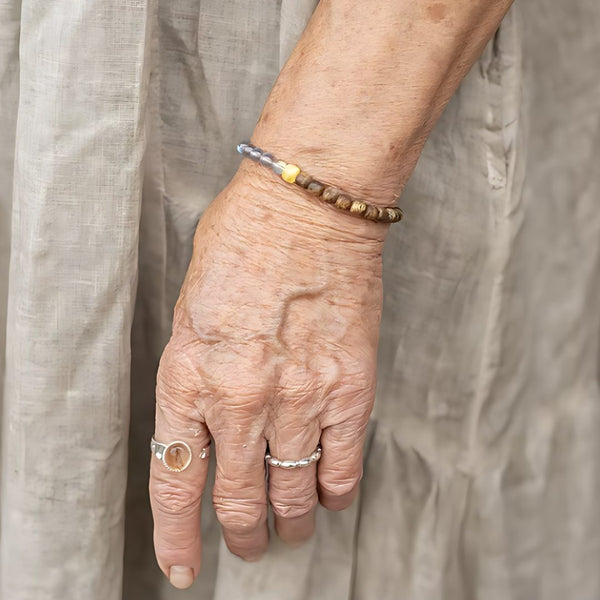 Half a Quiet Day, handmade agarwood & sandalwood, labradorite and citrine bracelet worn on the hand