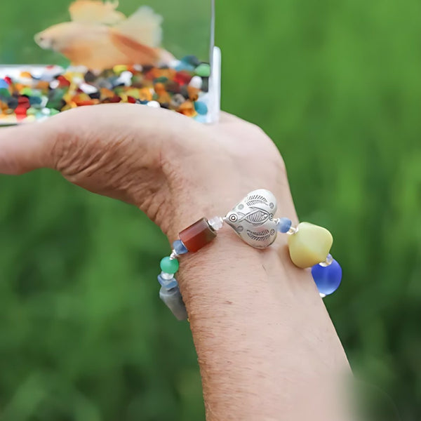Koi Matinee, handmade carnelian, citrine and lapis lazuli bracelet worn on the hand