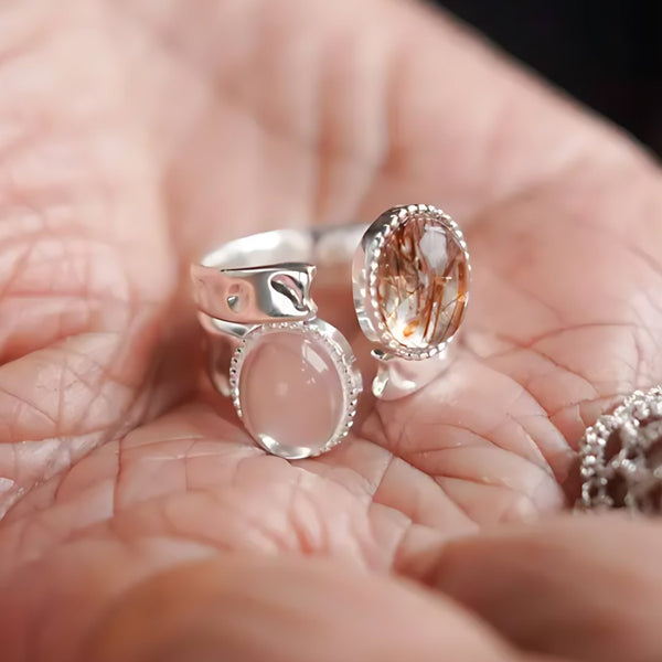 Light Catcher, handmade rose quartz and rutilated quartz ring worn on the hand