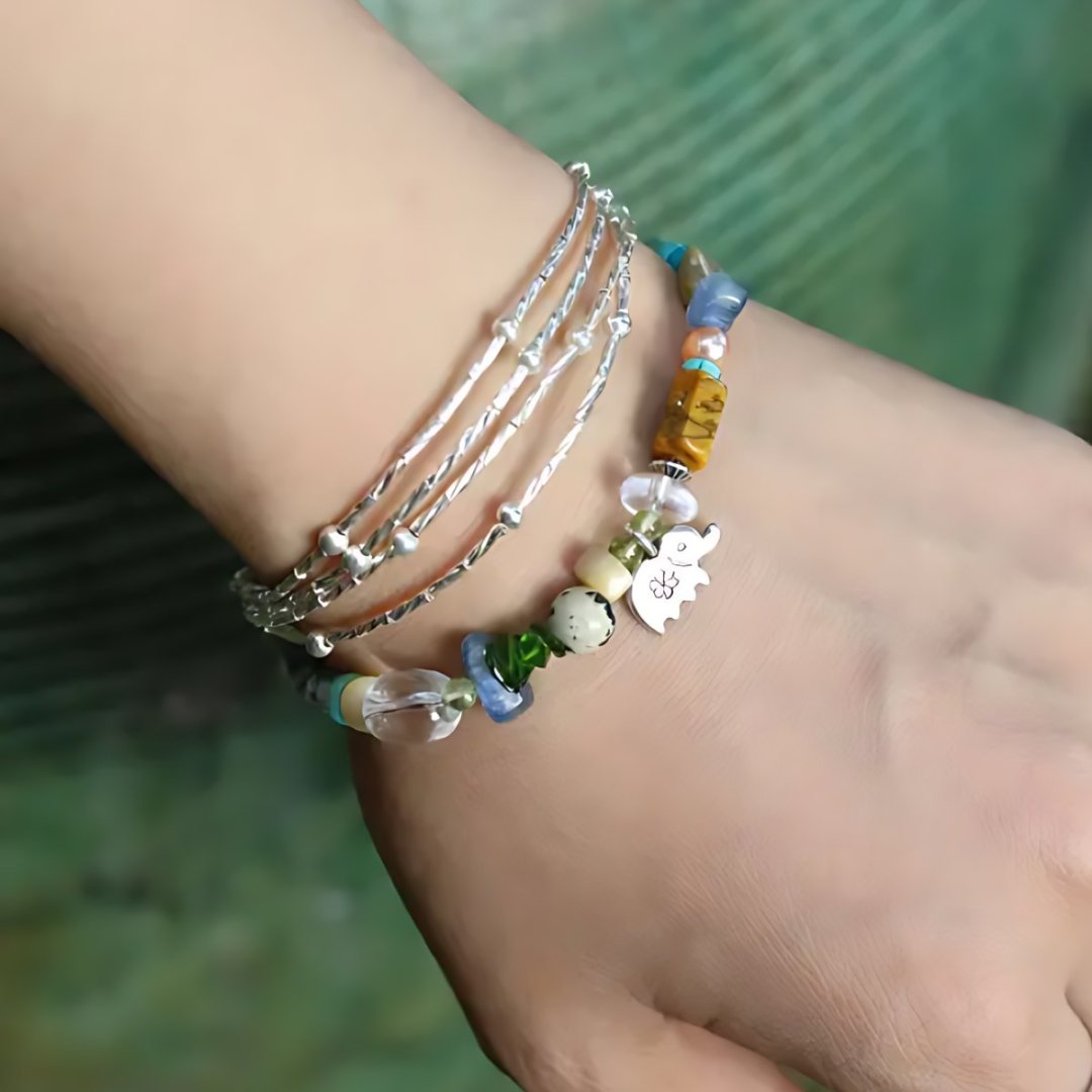 Little Elephant Parade, handmade clear quartz, aventurine & jade and lapis lazuli bracelet worn on the hand