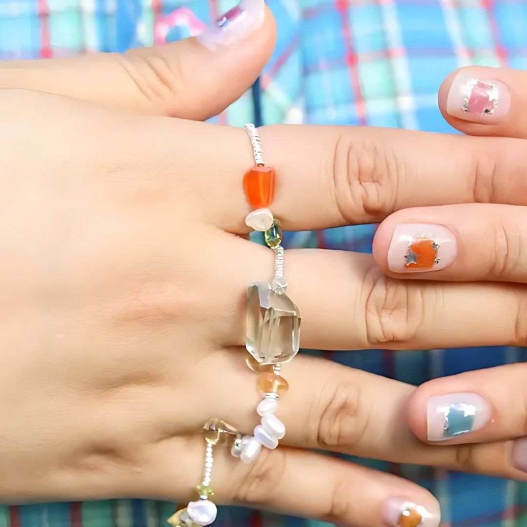 Summer Drift, handmade carnelian, smoky quartz and pearl ring worn on the hand