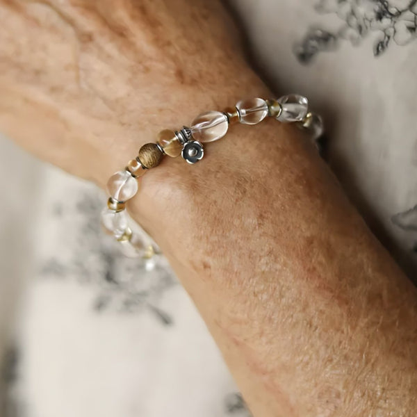 Tea at Four, handmade clear quartz, smoky quartz and tiger's eye bracelet worn on the hand