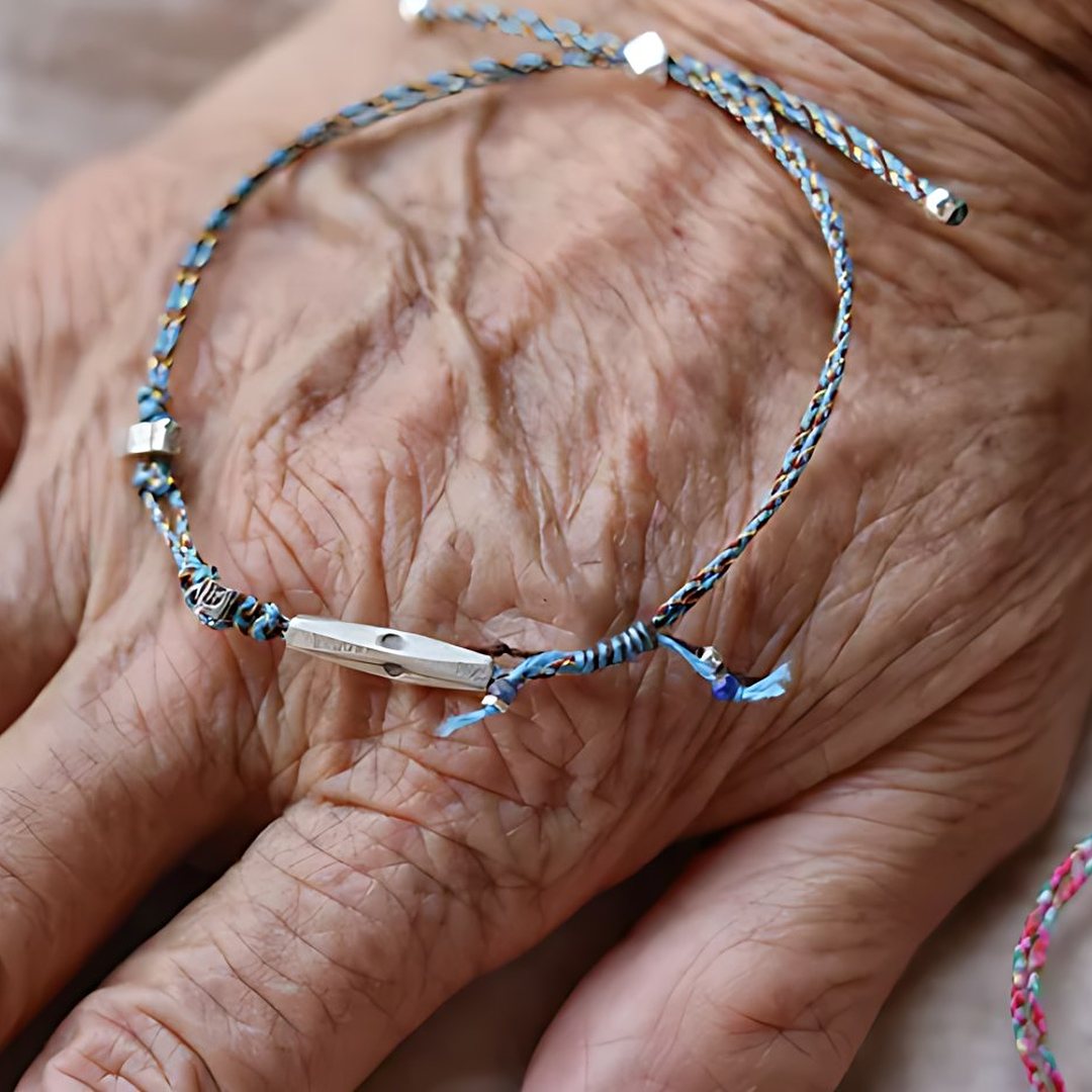 The Wishing Knot, handmade S925 silver cord bracelet worn on the hand