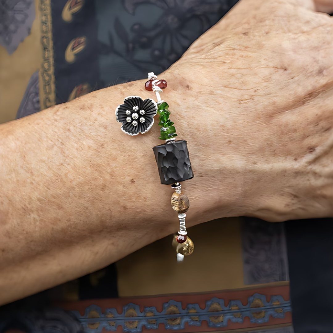 Wildflower Path, handmade aventurine & jade, obsidian and smoky quartz bracelet worn on the hand